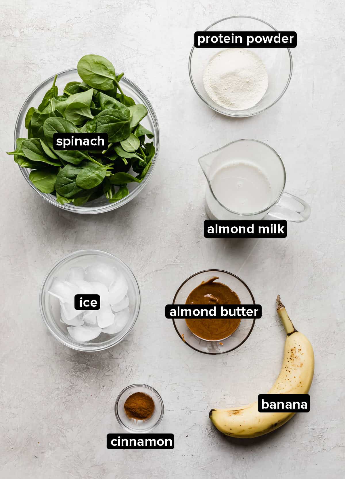 Green Protein Smoothie ingredients on a gray background.