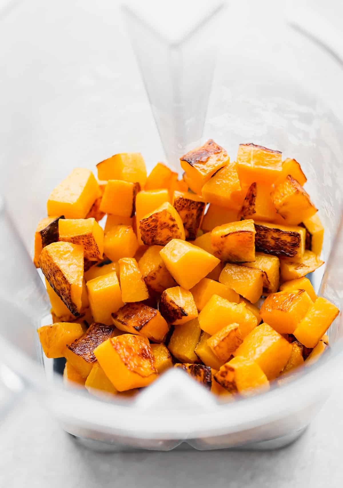 Roasted butternut squash in a blender.