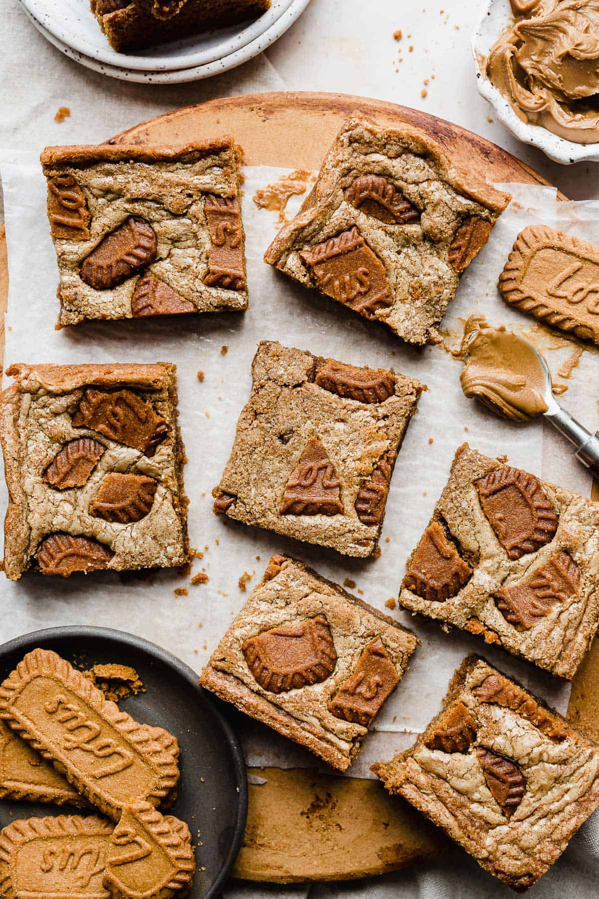 Biscoff Brownies topped with broken Biscoff cookie chunks.