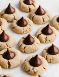 Peanut Butter Blossom cookies on a white background.
