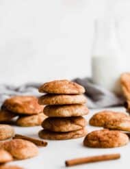 A stack of snickerdoodle cookies against a white background.