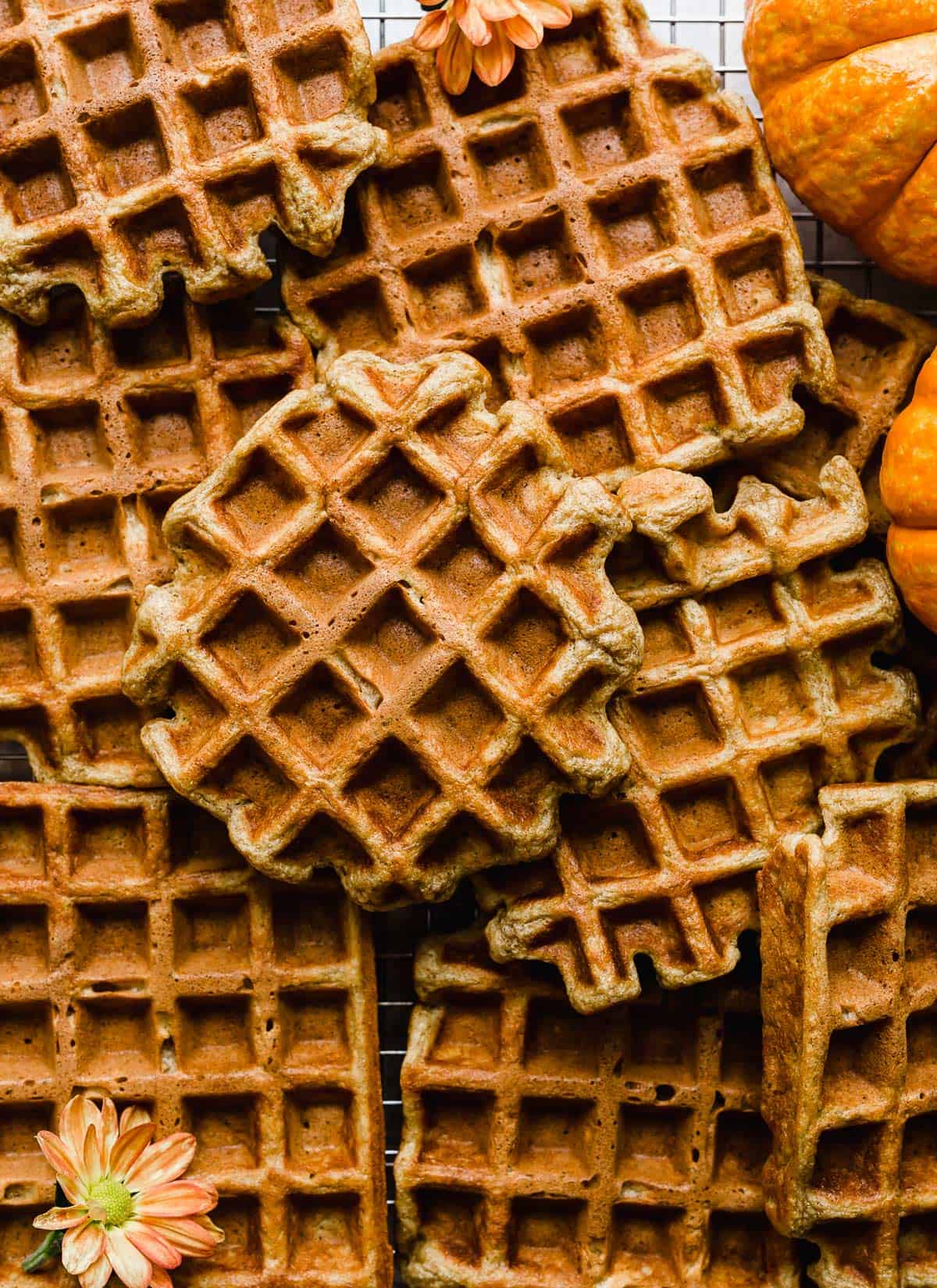 Pumpkin Waffles on a wire cooling rack.
