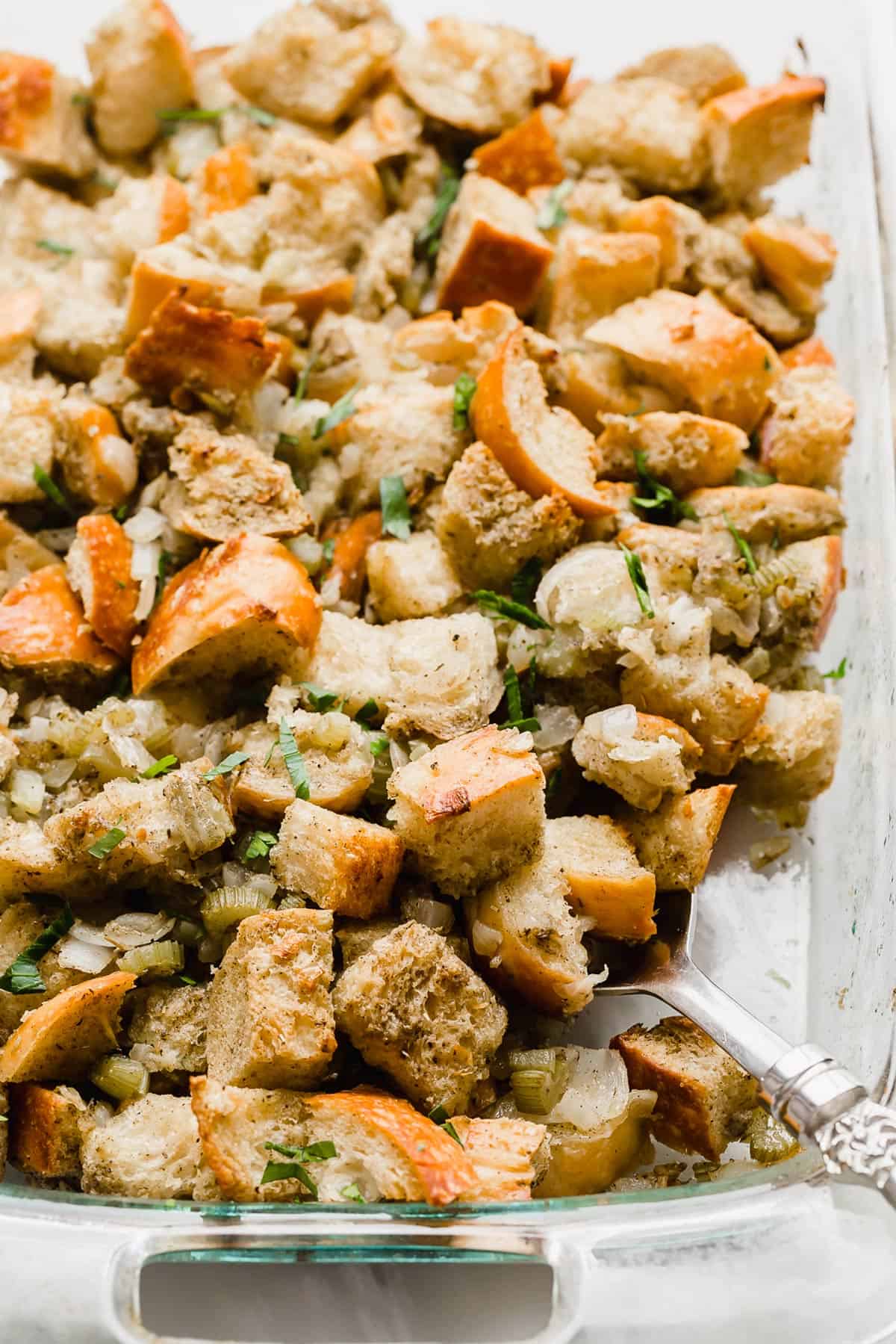 Thanksgiving Stuffing in a glass baking dish.