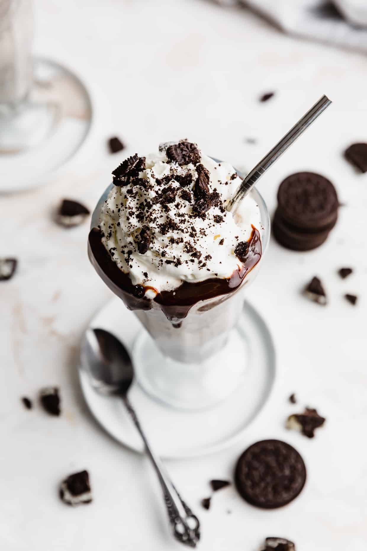 Overhead photo of an Oreo milkshake against a white background. 