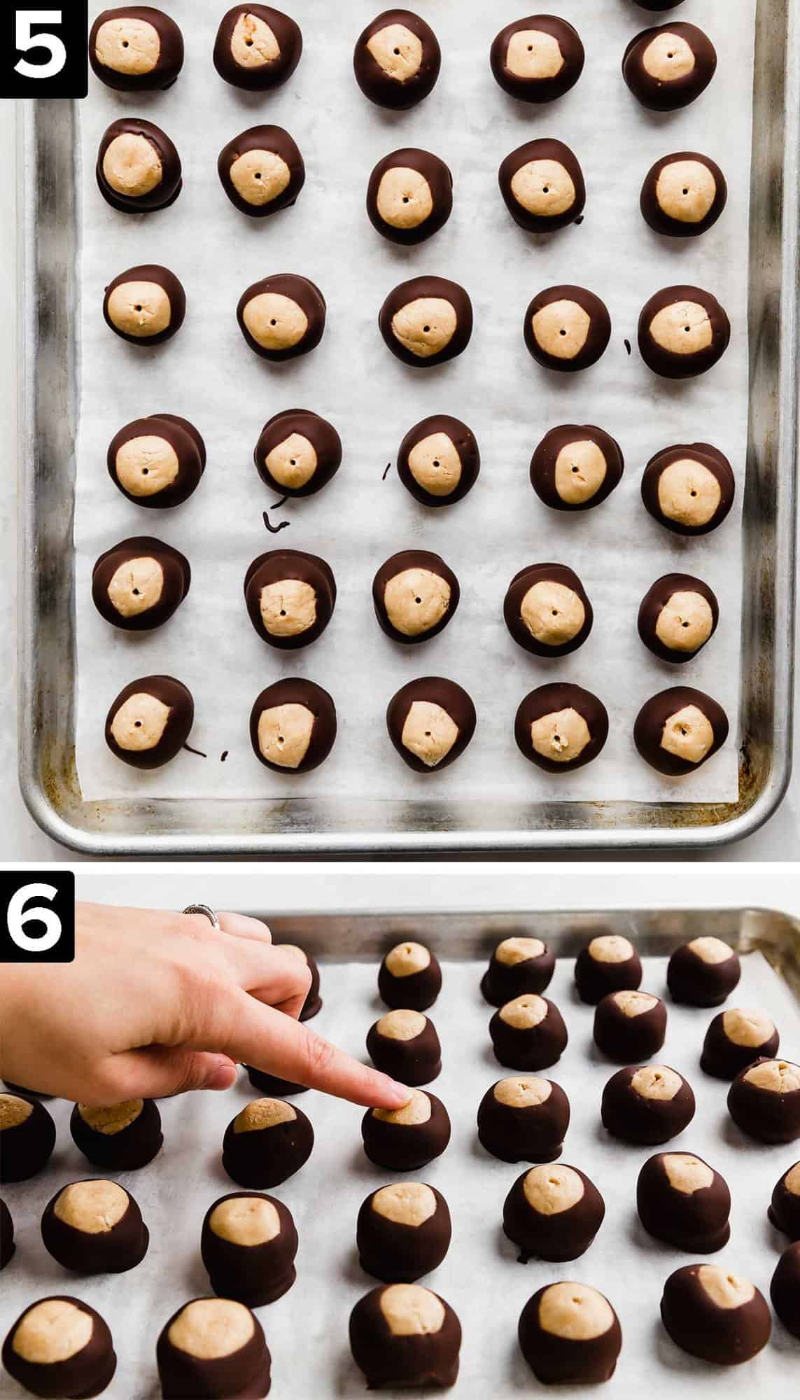 Chocolate dipped Buckeye balls on a baking sheet.