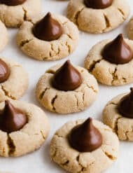 Peanut Butter Blossoms cookies on a white background.