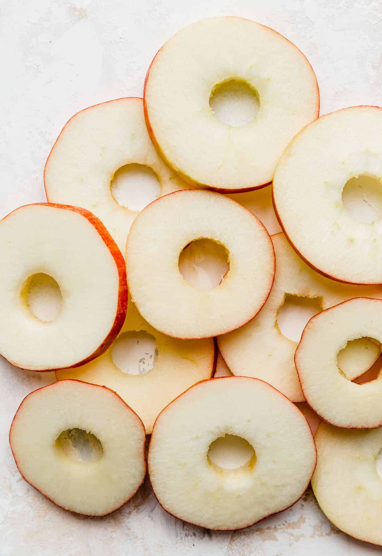 An apple sliced into rounds, looking like "donuts".
