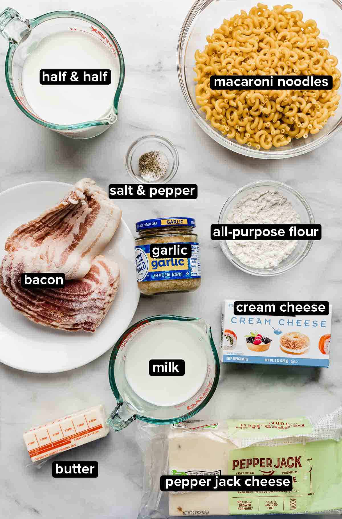 Pepper Jack Mac and Cheese ingredients portioned into glass bowls on a white background.