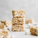 A stack of three Salted Brown Butter Rice Krispies Treats on top of each other.