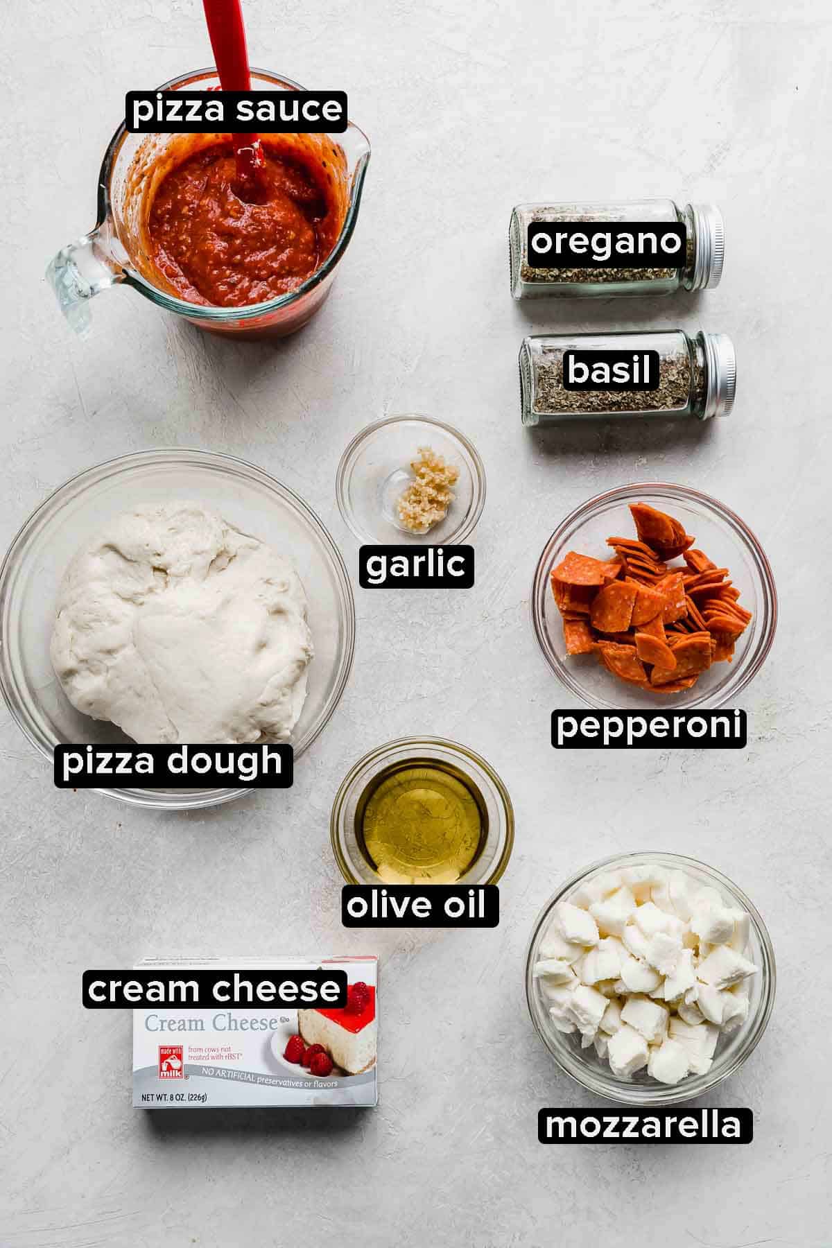 Pepperoni Pizza Dip ingredients on a white background.