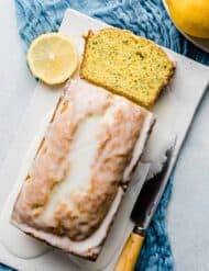 Lemon Poppy Seed Bread on a white rectangle plate.