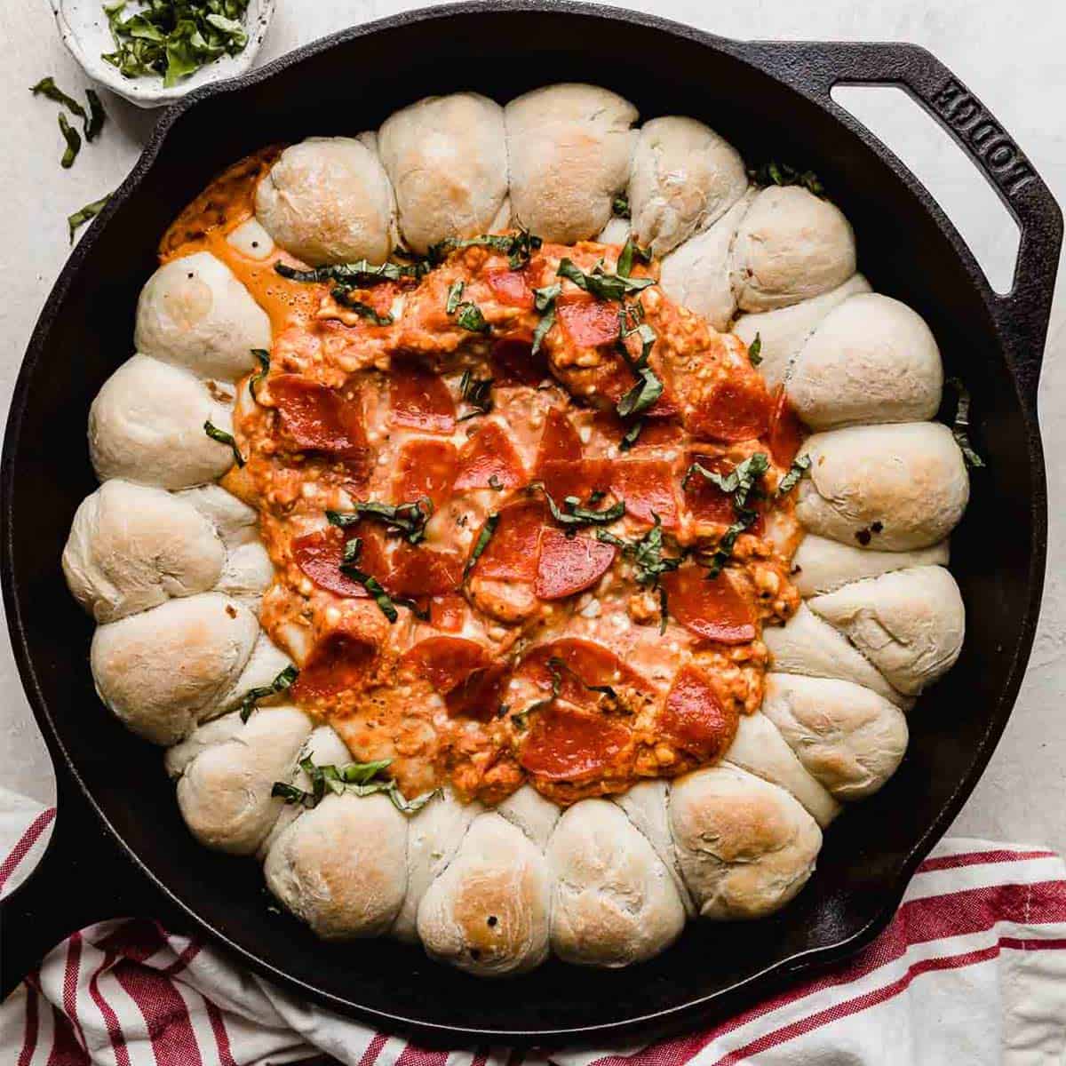 A Pepperoni Pizza Dip in a skillet.