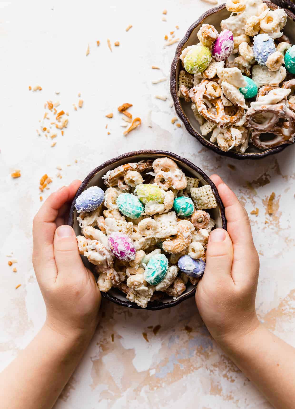 Small hands grabbing a bowl of bunny bait. 