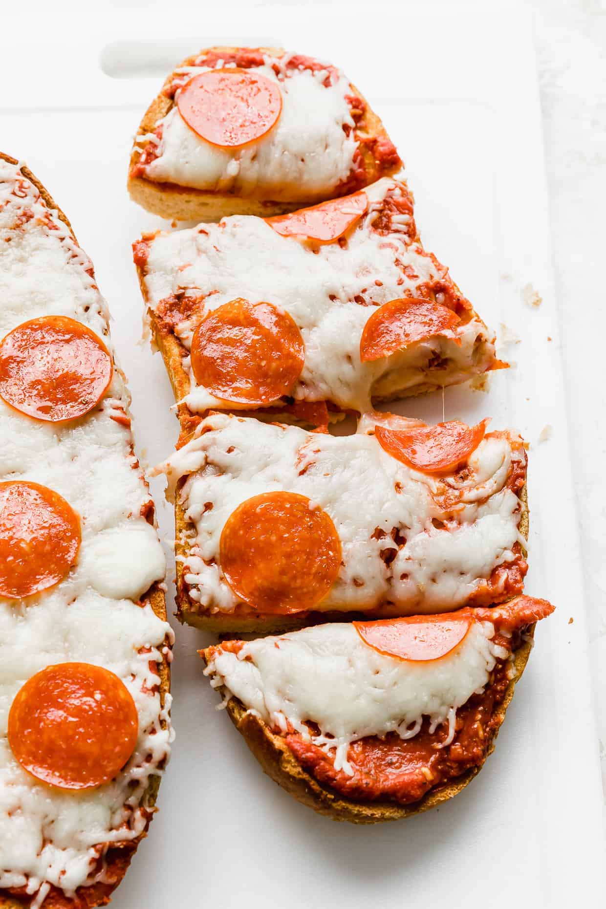  A pepperoni French bread pizza on a white background.
