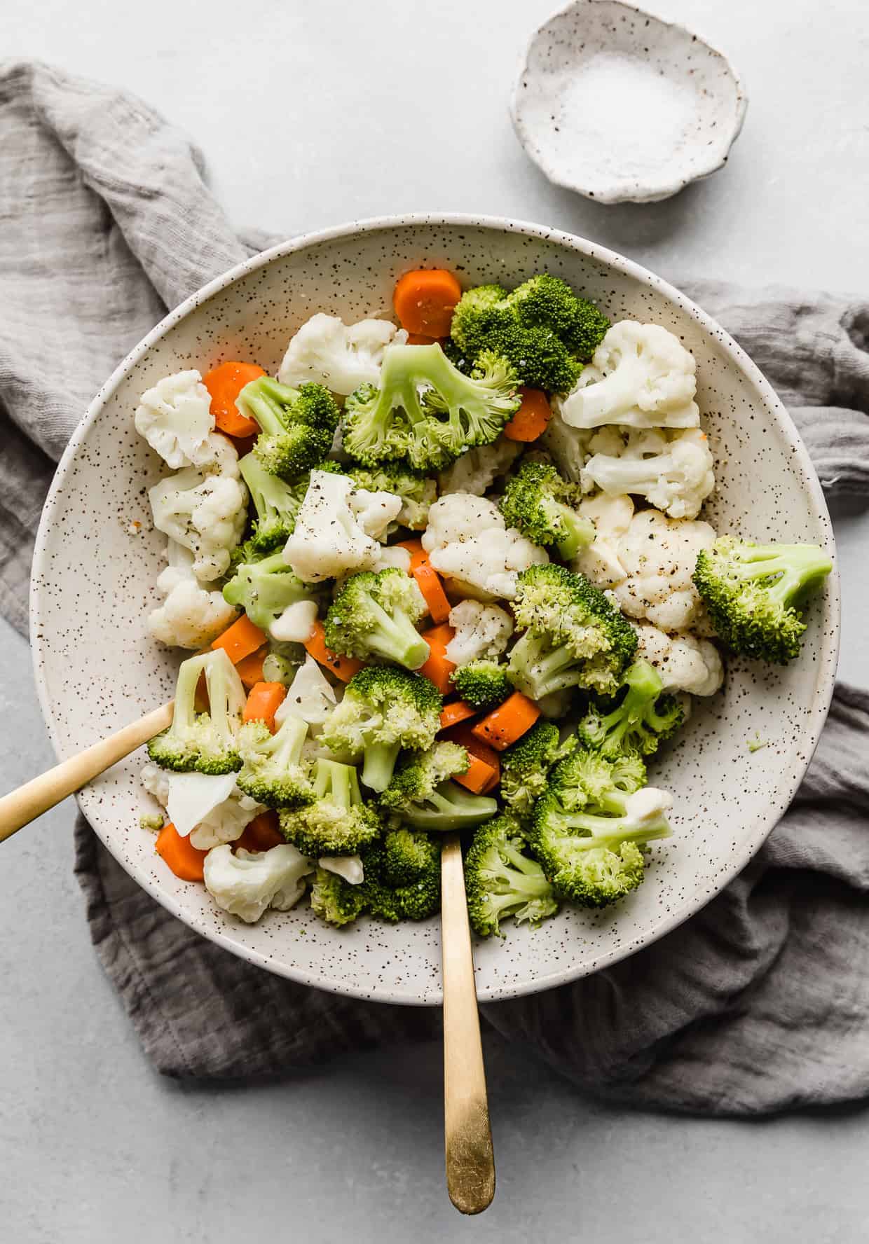 Buttered Vegetables featuring broccoli, cauliflower, and carrots in a serving bowl.