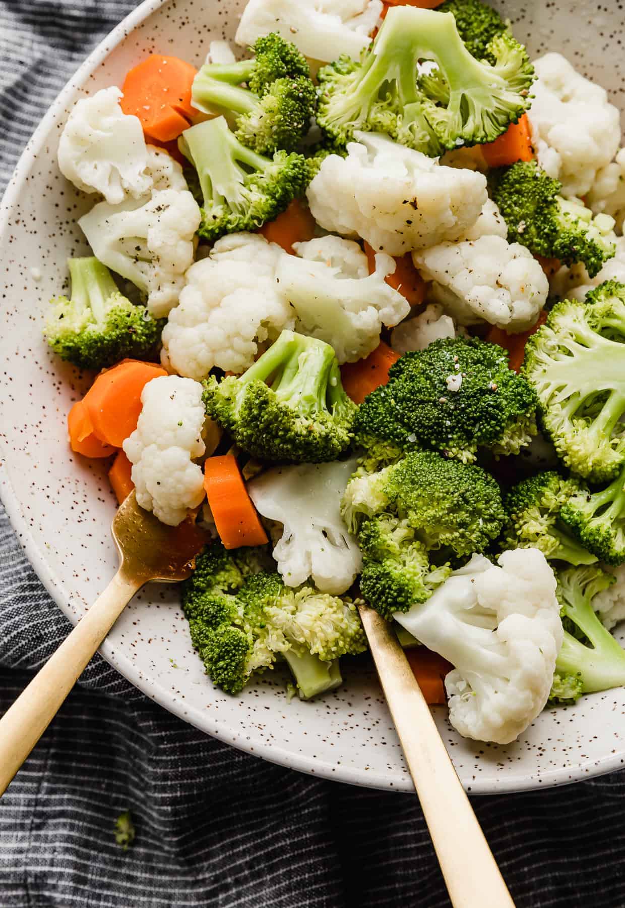 Close up photo of Buttered Vegetables, broccoli, cauliflower florets, and carrots.