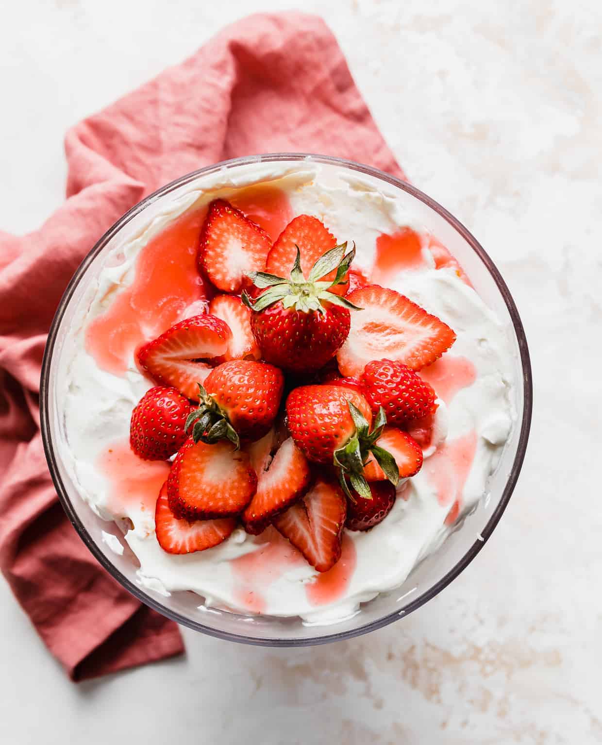Overhead photo of a Strawberry Shortcake Trifle topped with sliced strawberries.