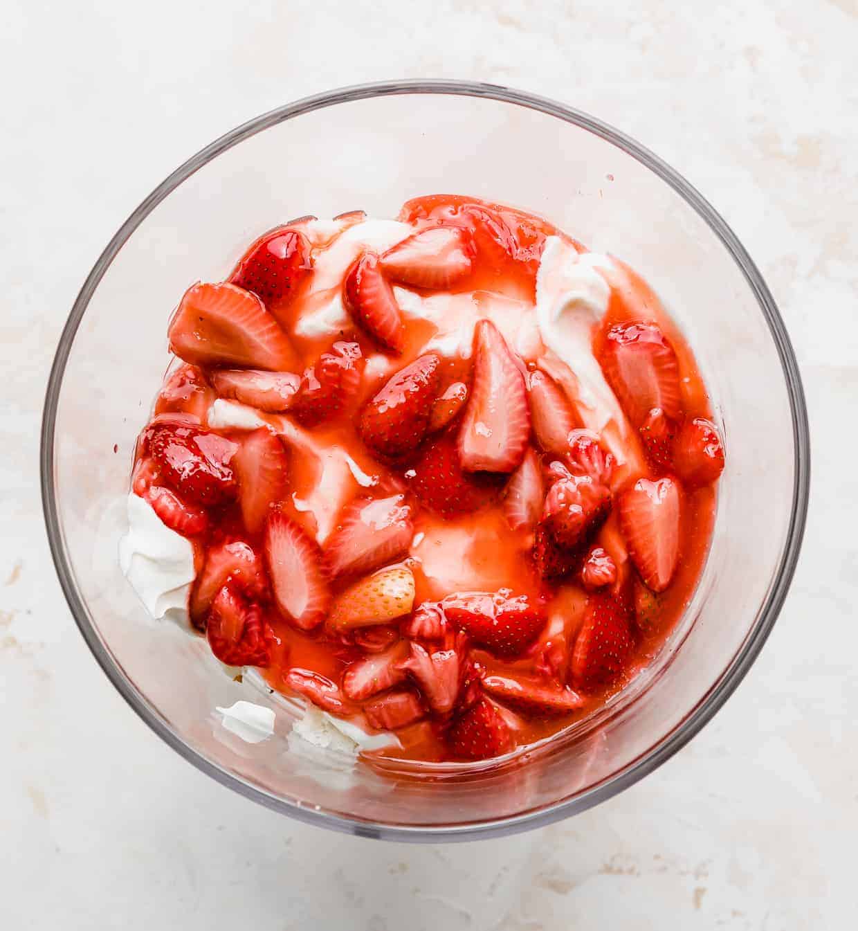 Strawberry sauce in a glass trifle dish.