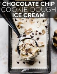 An ice cream scoop with chocolate chip cookie dough ice cream in it.
