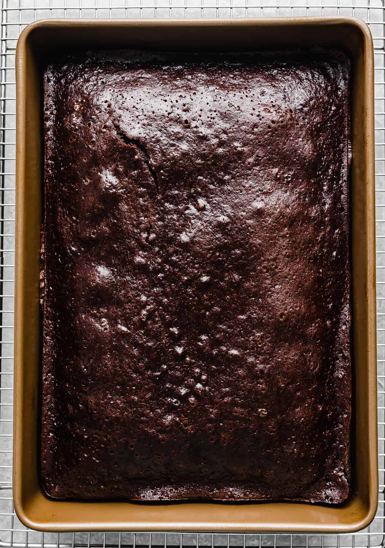 A chocolate cake baked in a 13x9 inch pan.