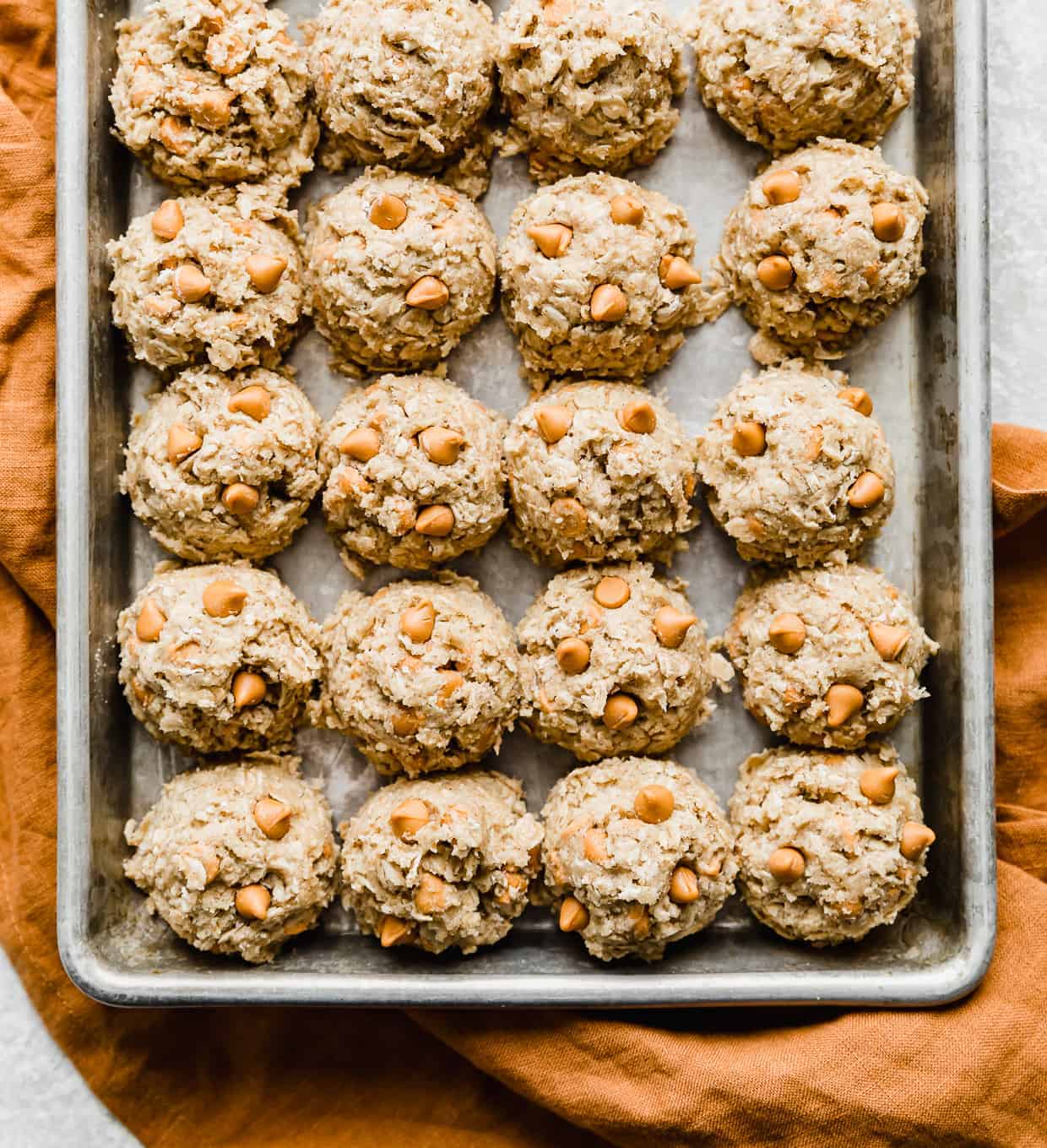 Oatmeal Butterscotch Cookie dough balls on a baking sheet.