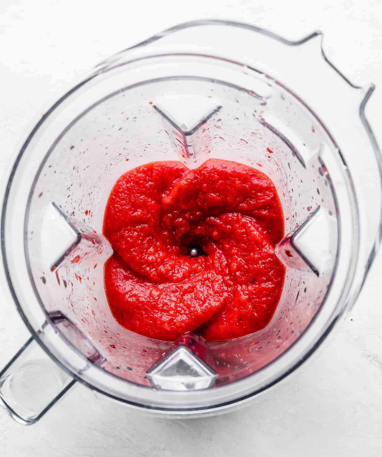 A blender with Virgin Strawberry Daiquiri pureed inside the blender.