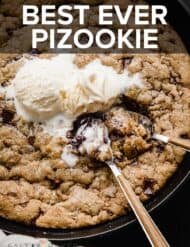 Close up of a pizookie and two spoons scooping into the cookie.