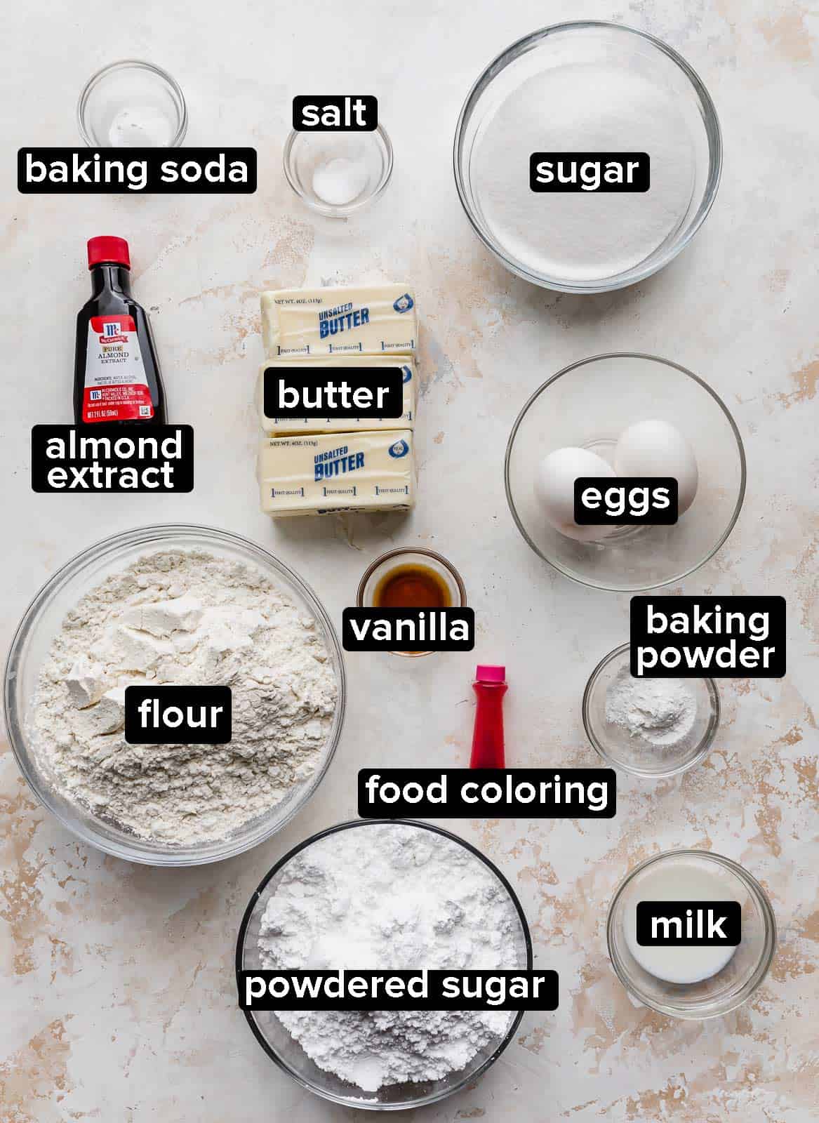 Ingredients used to make copycat crumbl sugar cookie recipe on a gray background.
