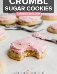 A Copycat Crumbl sugar cookie with a bite taken out of it.