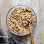 A bowl of Streusel Topping on a light wooden background.
