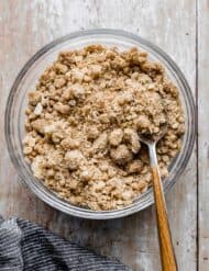 A bowl of Streusel Topping on a light wooden background.