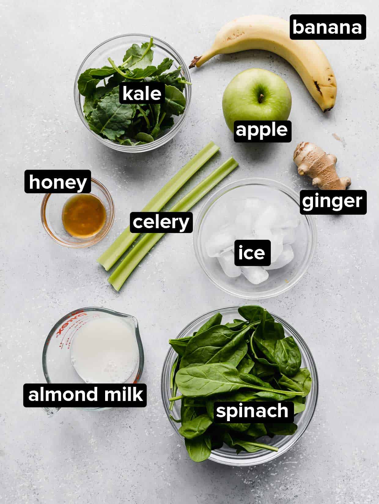 Ingredients used to make a celery smoothie: celery, apple, kale, spinach, banana, milk.