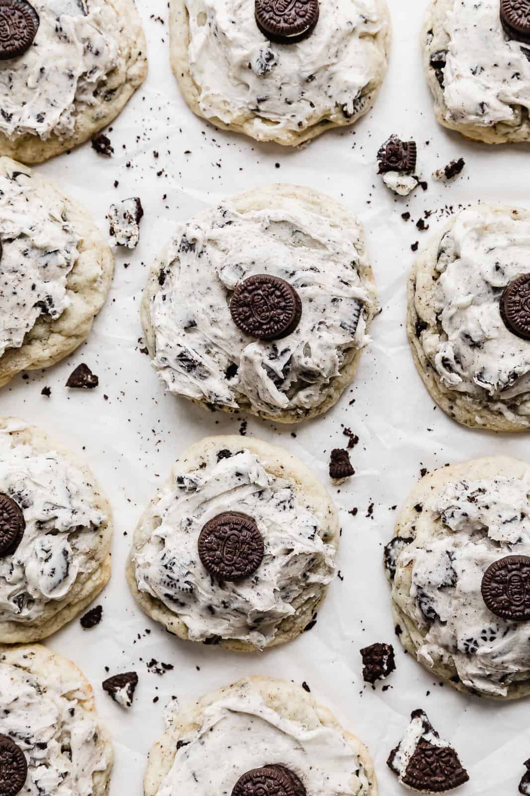 Overhead photo of cookies and cream cookies topped with a frosting and mini Oreo.