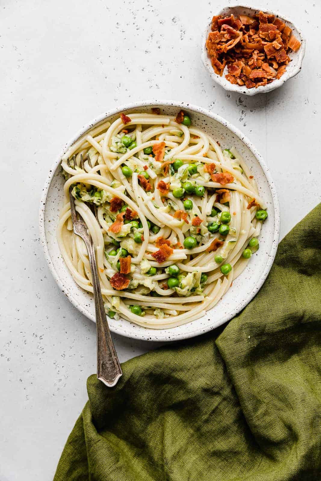 Bacon Pasta with Zucchini Sauce on a white plate.