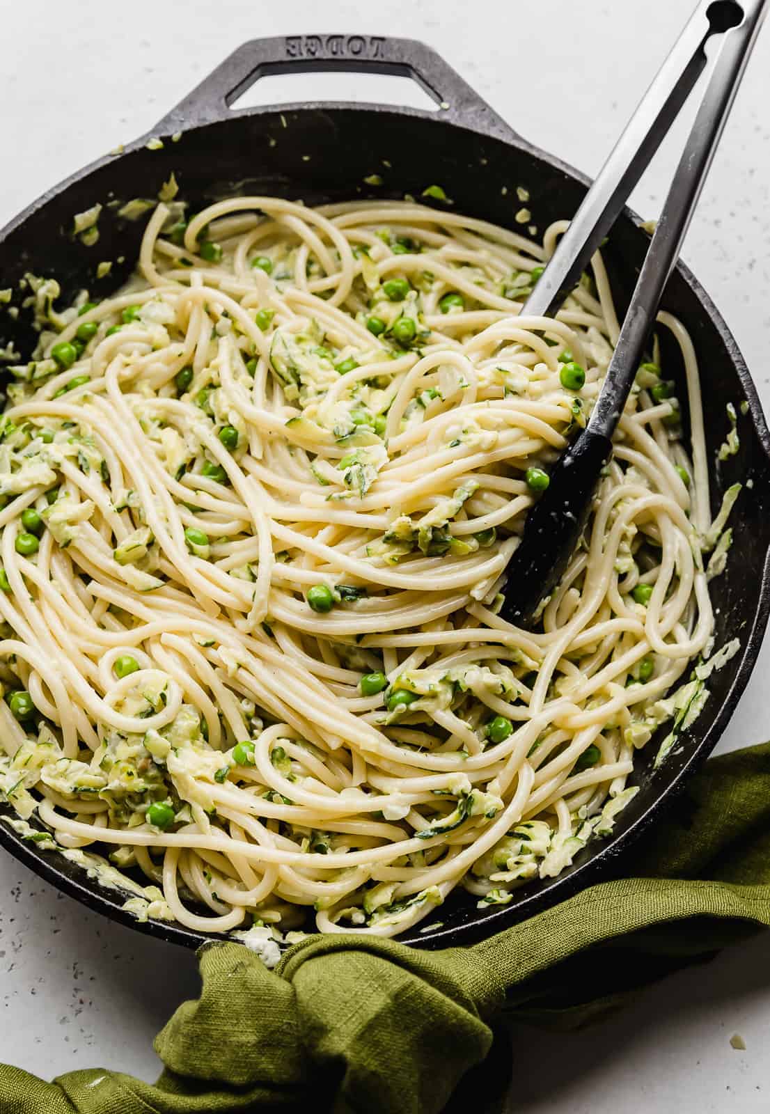 Close up photo of Pasta with Zucchini Sauce in a black skillet.