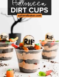 Oreo crumb and chocolate pudding layered Halloween Dirt Cups against a white background.