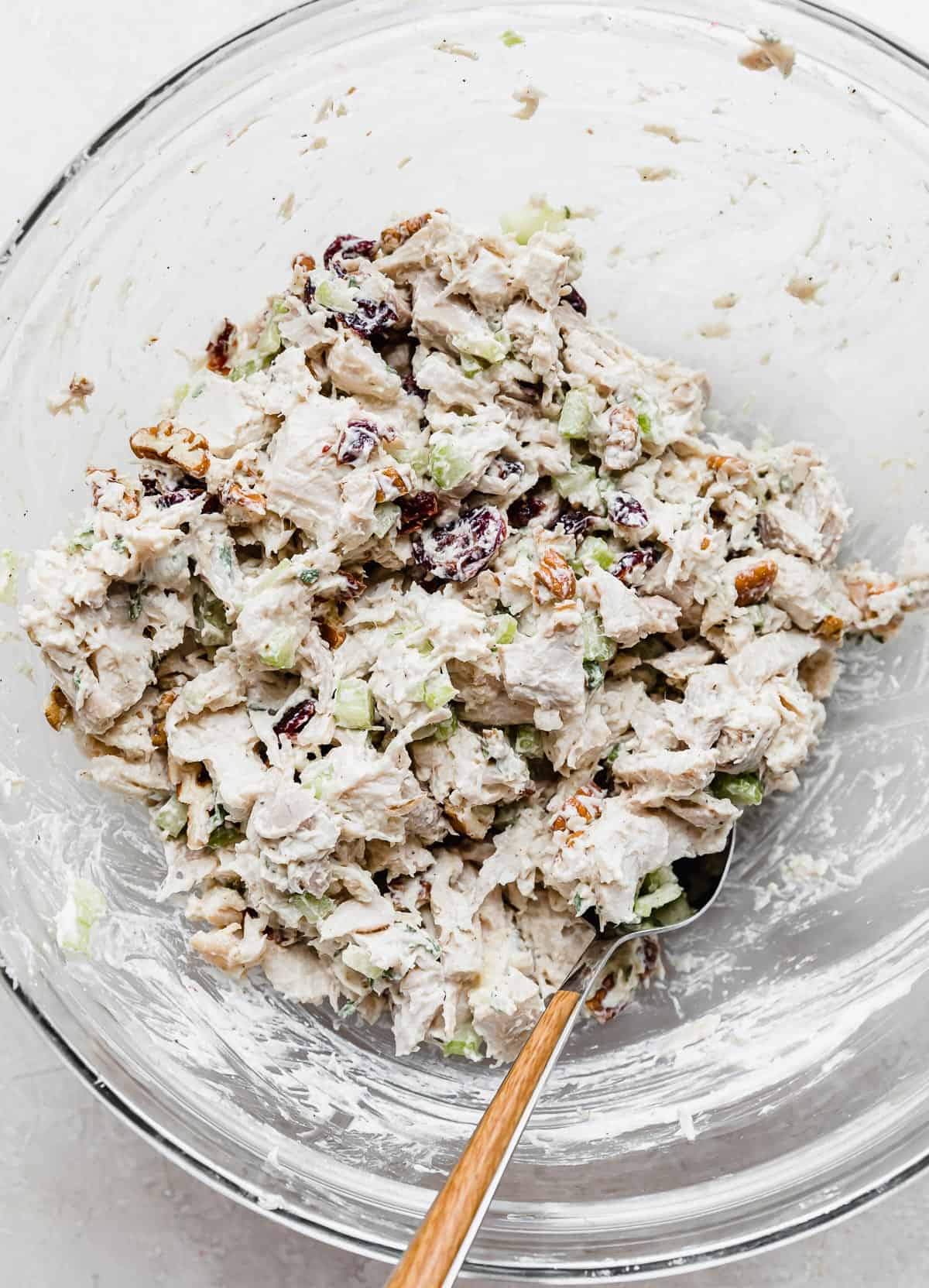 Leftover Cranberry Turkey Salad Sandwich ingredients mixed in a glass bowl.
