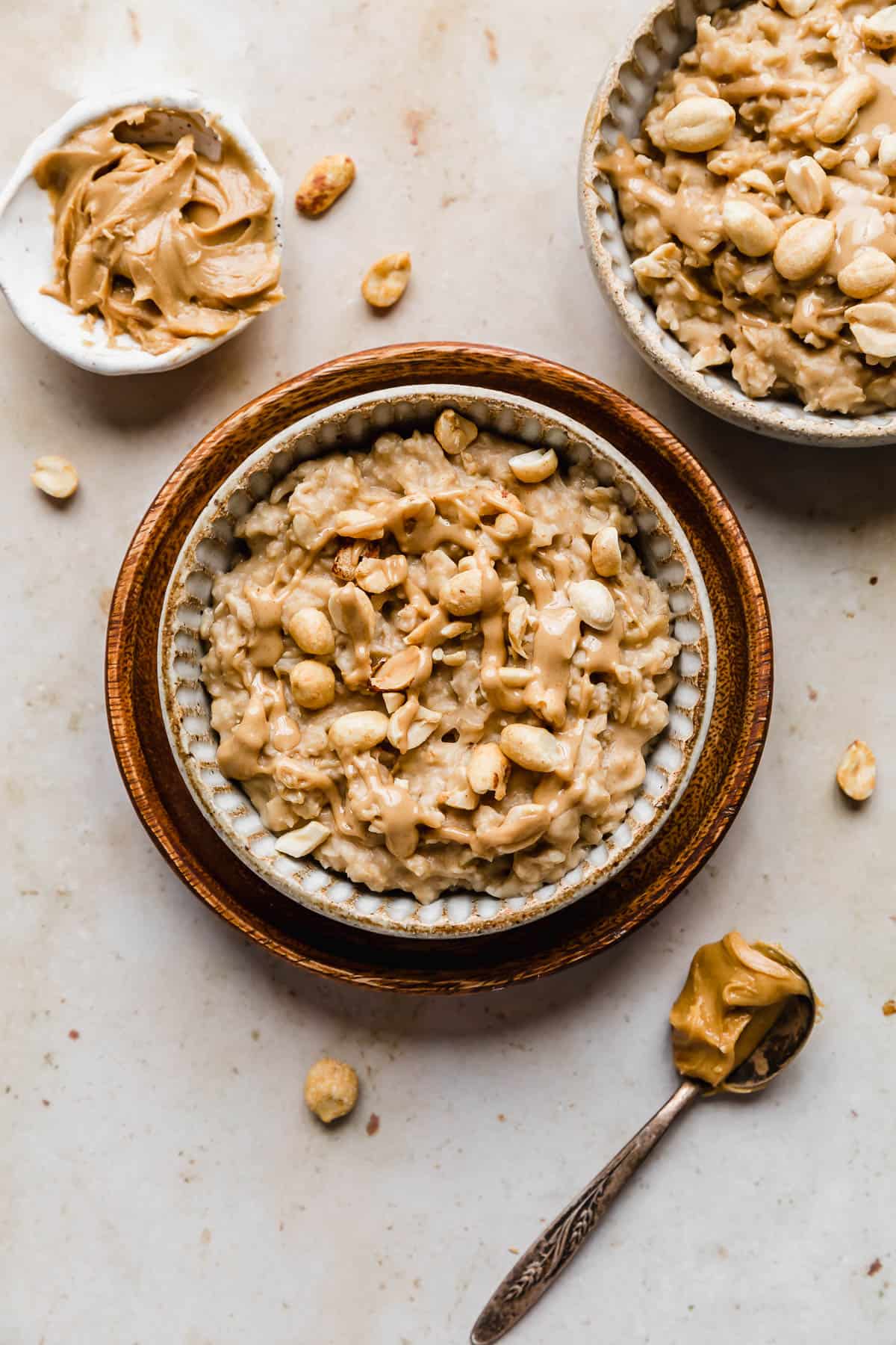 Peanut Butter Oatmeal topped with chopped nuts and melted peanut butter.