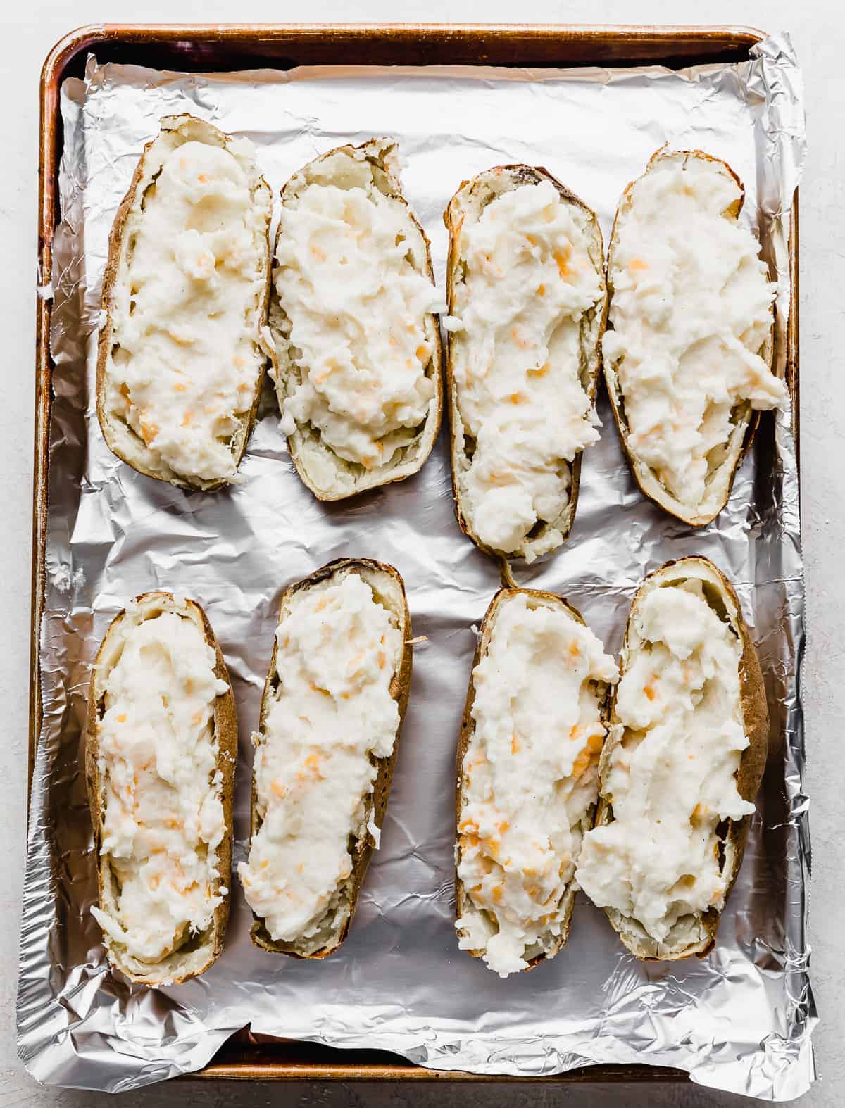 Potato skins filled with Twice Baked Potatoes with Cream Cheese mixture.