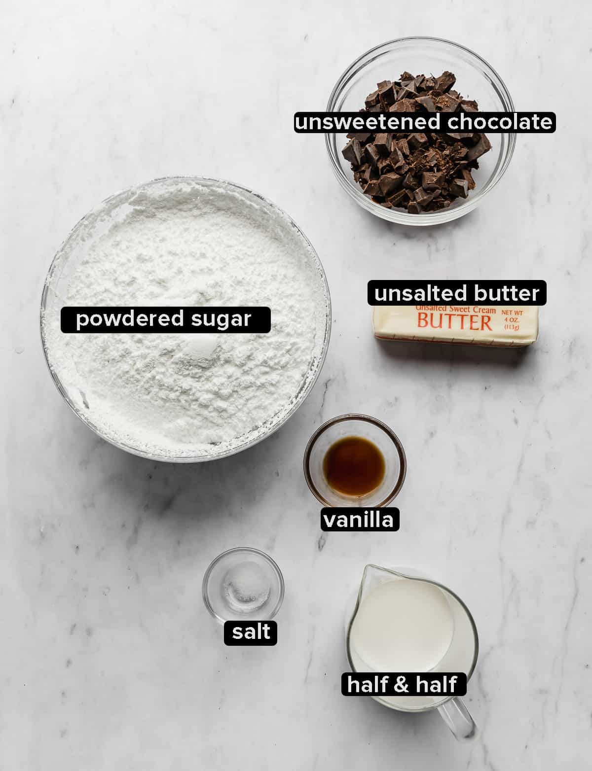 Ingredients used to make the chocolate frosting on a chocolate Bundt Cake: ingredients include powdered sugar, unsweetened chocolate, butter, vanilla, half and half, and salt.
