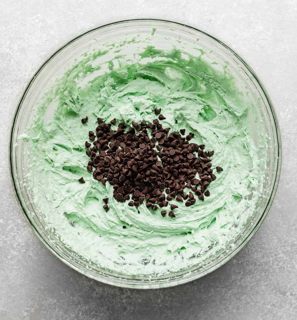 Mini chocolate chips in a mint colored frosting.