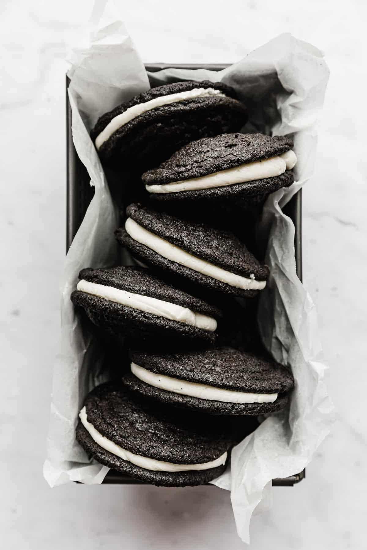 Homemade Oreo Cookies in a bread pan on a white background. 