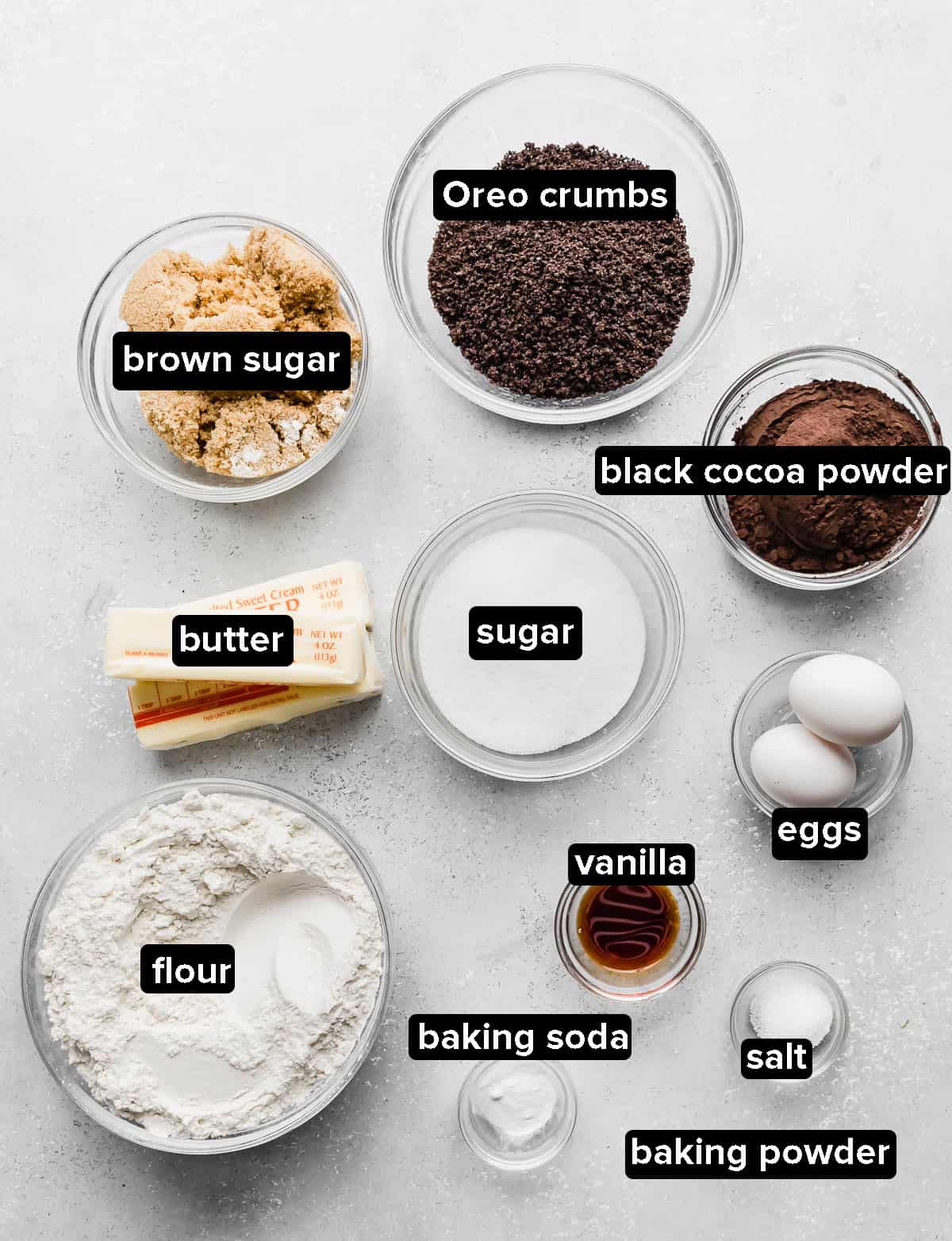 Homemade Oreo Cookie ingredients in glass bowls on a white background.