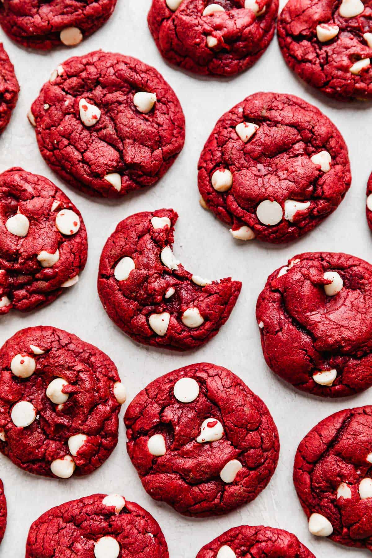 White chocolate chip Red Velvet Cake Mix Cookies on a white background.