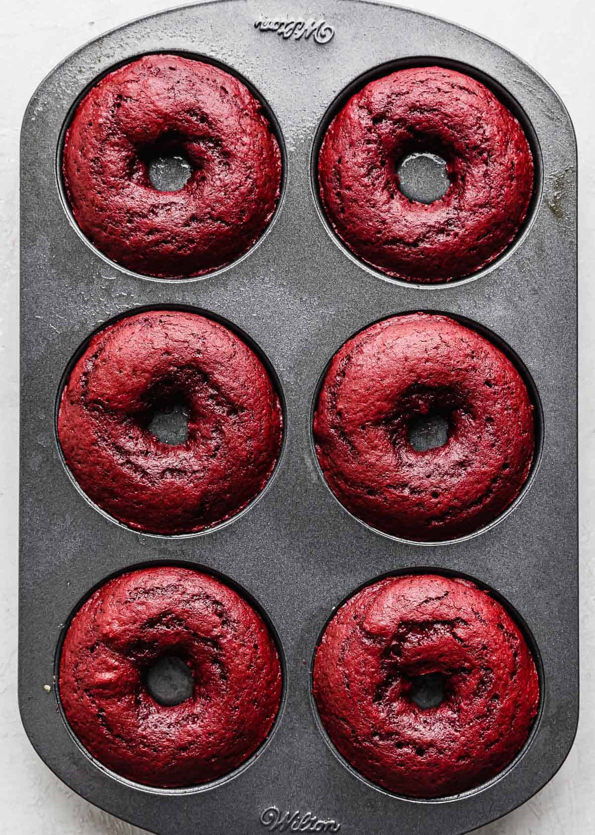 Baked Red Velvet Donuts in a donut pan.