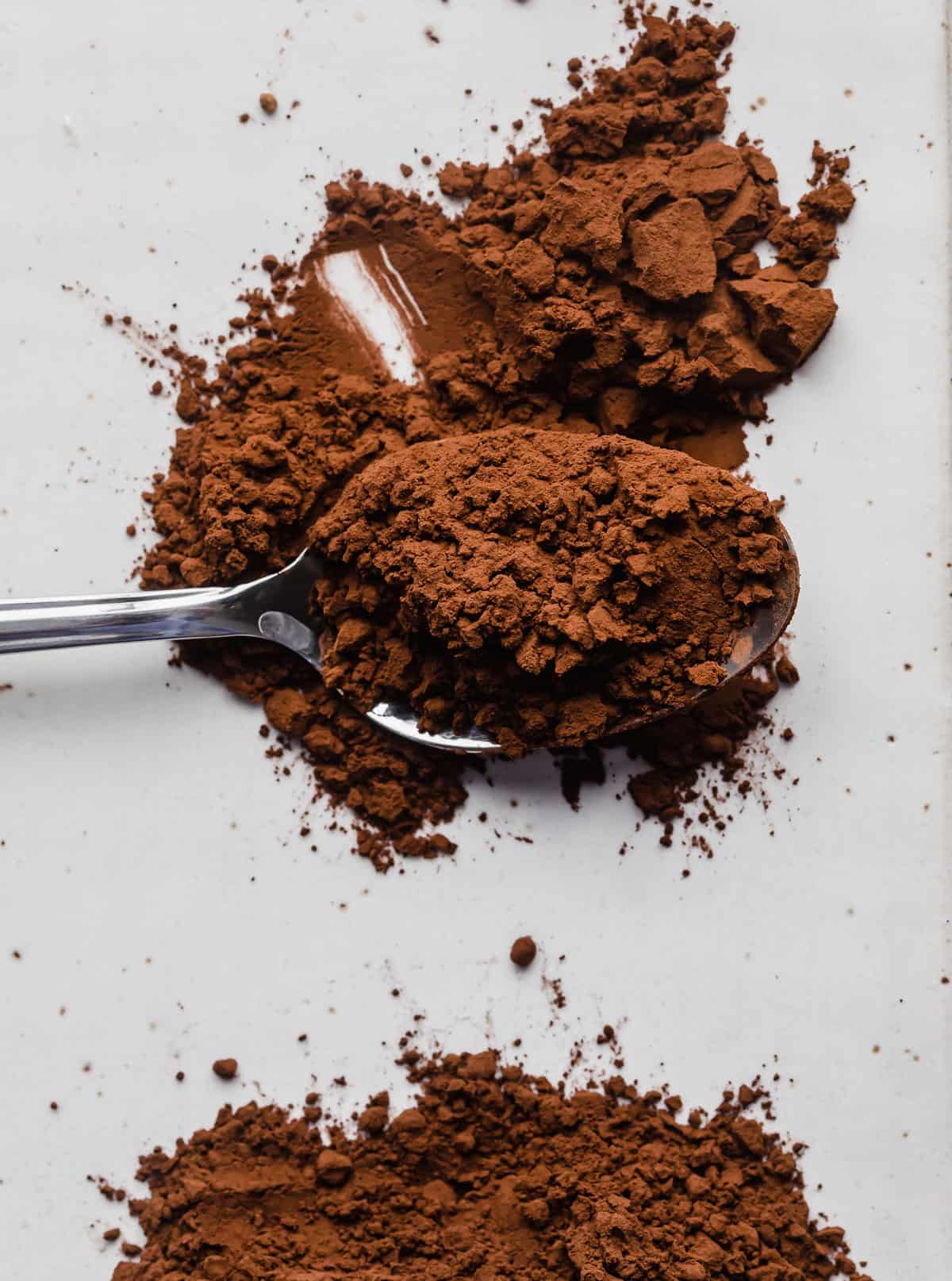 Dutch processed cocoa powder on a spoon.