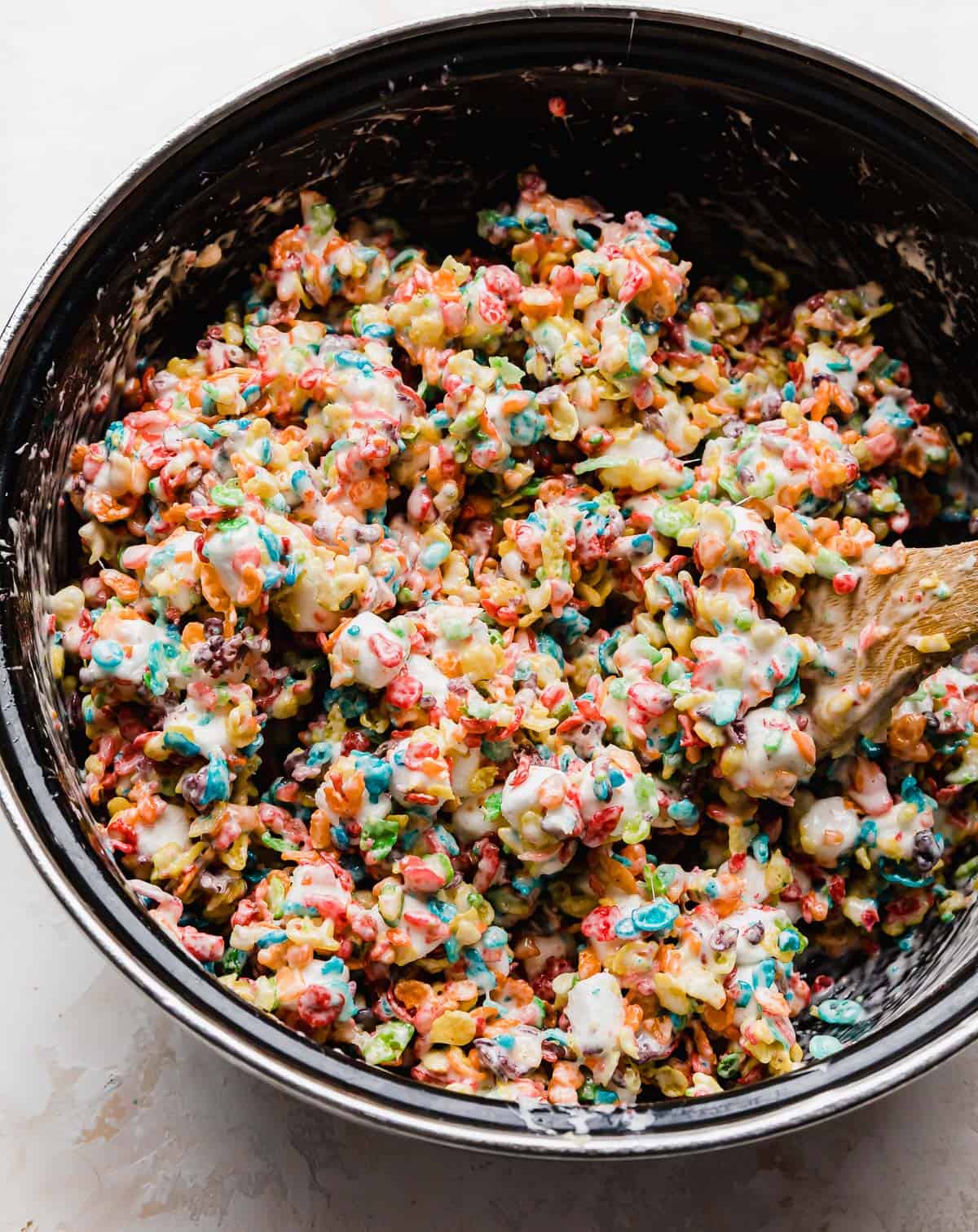 A close up photo of Fruity Pebbles Rice Krispies in a black pot.