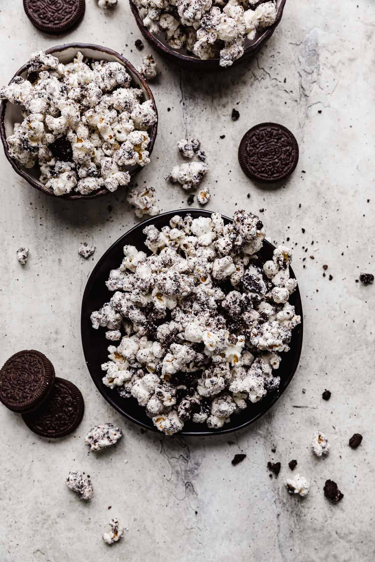 Oreo Popcorn  on a black plate.