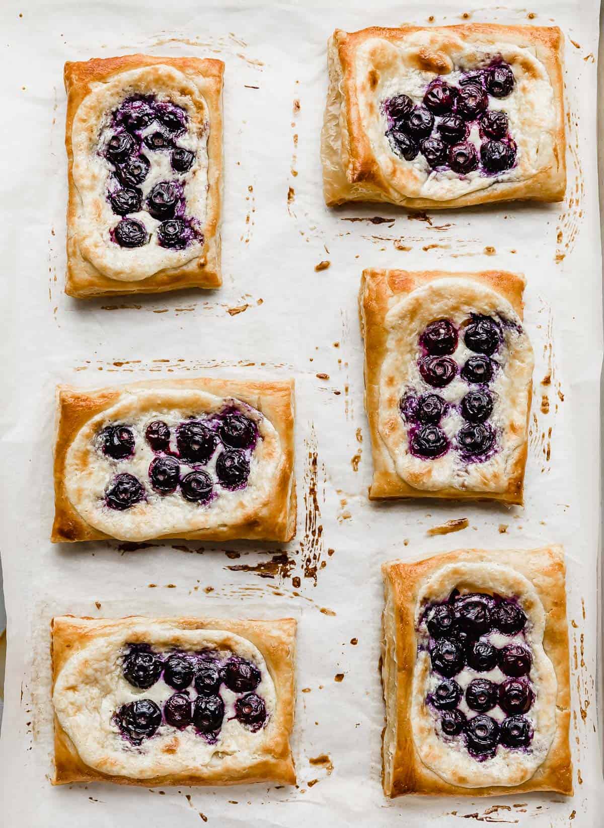 Baked Blueberry Danish puff pastry on a baking sheet.