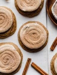 Swirled frosting topped with cinnamon sugar, over a churro cookie.